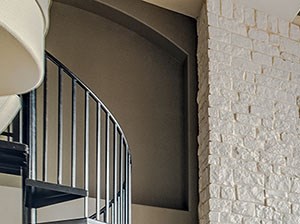 Creekside View Apartments l Clubhouse with fireplace seating and stairs